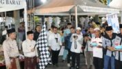 Bupati Tanjung Jabung Barat, Anwar Sadat, mendampingi Gubernur Jambi, Al Haris pada pembukaan dan pelepasan peserta Festival Arakan Sahur